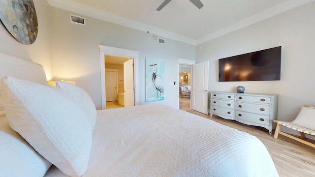 11807 Front Beach Rd Unit 1- 2204, Panama City Beach, FL 32407 - bedroom with ornamental molding, wood finished floors, ensuite bath, and a ceiling fan