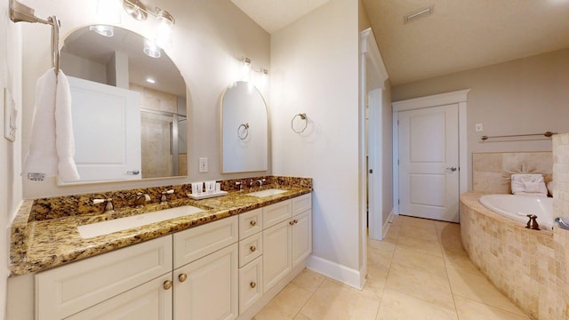 11807 Front Beach Rd Unit 1- 2204, Panama City Beach, FL 32407 - full bath featuring double vanity, a garden tub, baseboards, an enclosed shower, and tile patterned floors