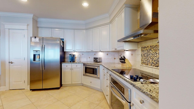 11807 Front Beach Rd Unit 1- 2204, Panama City Beach, FL 32407 - kitchen featuring stainless steel appliances, wall chimney range hood, backsplash, light stone countertops, and ornamental molding