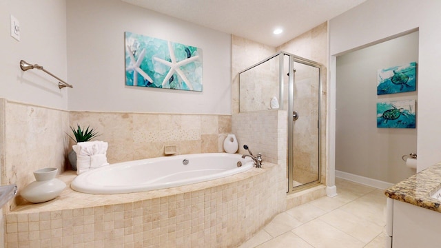 11807 Front Beach Rd Unit 1- 2204, Panama City Beach, FL 32407 - bathroom with vanity, a garden tub, a stall shower, and tile patterned flooring