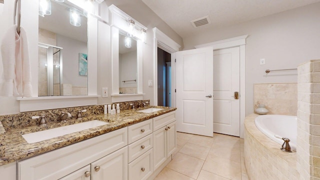 11807 Front Beach Rd Unit 1- 2204, Panama City Beach, FL 32407 - bathroom with double vanity, a shower stall, a bath, and tile patterned floors