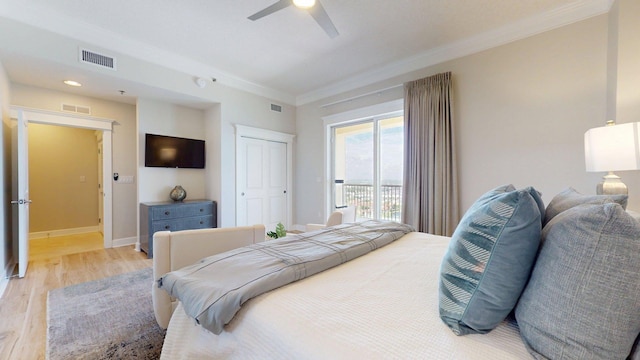 11807 Front Beach Rd Unit 1- 2204, Panama City Beach, FL 32407 - bedroom featuring crown molding, light wood-style floors, baseboards, a ceiling fan, and a closet