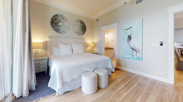 11807 Front Beach Rd Unit 1- 2204, Panama City Beach, FL 32407 - bedroom featuring crown molding, light wood finished floors, connected bathroom, and baseboards