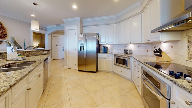 11807 Front Beach Rd Unit 1- 2204, Panama City Beach, FL 32407 - kitchen with appliances with stainless steel finishes, extractor fan, a sink, arched walkways, and ornamental molding