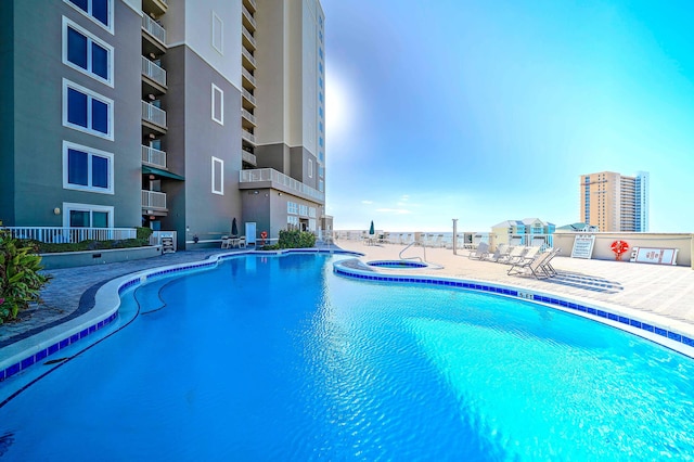 11807 Front Beach Rd Unit 1- 2204, Panama City Beach, FL 32407 - community pool featuring a community hot tub and a patio area