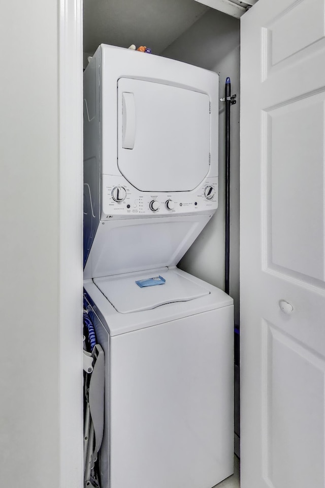 1200 Scenic Gulf Dr Unit B412, Miramar Beach, FL 32550 - laundry area with stacked washing machine and dryer