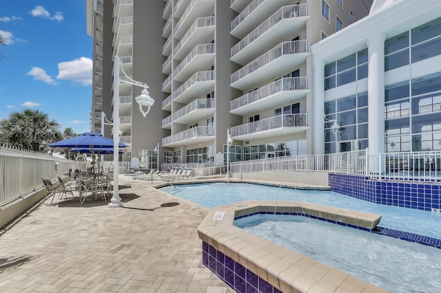 1200 Scenic Gulf Dr Unit B412, Miramar Beach, FL 32550 - community pool with a hot tub and a patio