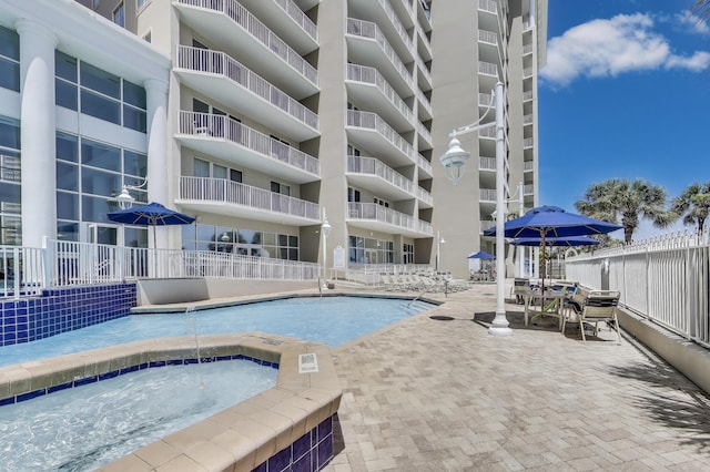 1200 Scenic Gulf Dr Unit B412, Miramar Beach, FL 32550 - community pool with a community hot tub and a patio area