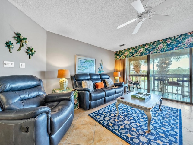 85 S Driftwood Bay Unit 227, Miramar Beach, FL 32550 - living room featuring a textured ceiling, light tile patterned floors, and ceiling fan