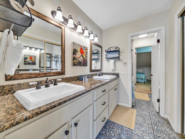 85 S Driftwood Bay Unit 227, Miramar Beach, FL 32550 - full bathroom with double vanity, tile patterned flooring, ensuite bathroom, and baseboards