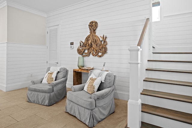 14 The Heron Cv, Inlet Beach, FL 32461 - sitting room featuring ornamental molding, wood walls, stairway, and light tile patterned flooring