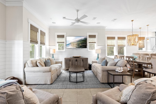 14 The Heron Cv, Inlet Beach, FL 32461 - living area featuring light tile patterned floors, a wainscoted wall, ceiling fan, a chandelier, and wooden walls