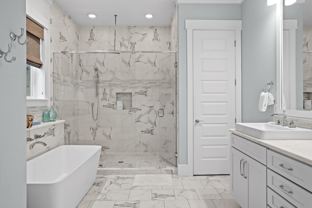 14 The Heron Cv, Inlet Beach, FL 32461 - bathroom with a freestanding tub, a marble finish shower, marble finish floors, vanity, and recessed lighting