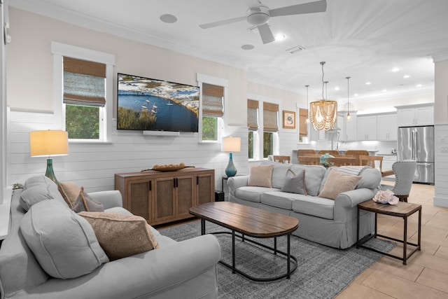 14 The Heron Cv, Inlet Beach, FL 32461 - living area with light tile patterned flooring, ceiling fan, ornamental molding, recessed lighting, and a chandelier