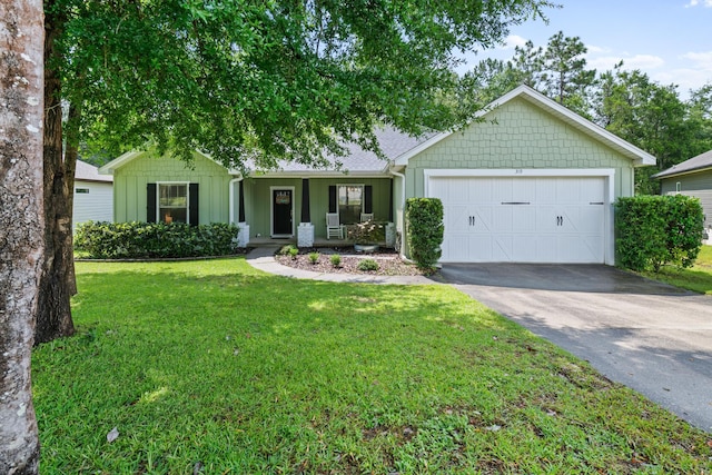 319 Key Lime Pl, Crestview, FL 32536 - ranch-style house with board and batten siding, asphalt driveway, an attached garage, a front yard, and roof with shingles