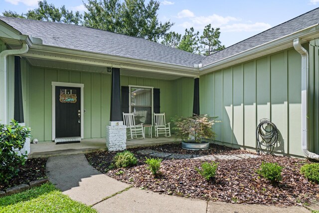 319 Key Lime Pl, Crestview, FL 32536 - view of exterior entry featuring a porch and a shingled roof