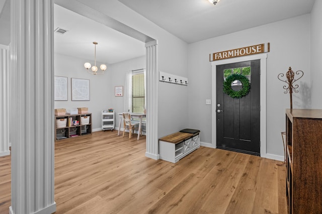 319 Key Lime Pl, Crestview, FL 32536 - entrance foyer featuring plenty of natural light, light wood-style flooring, and a chandelier