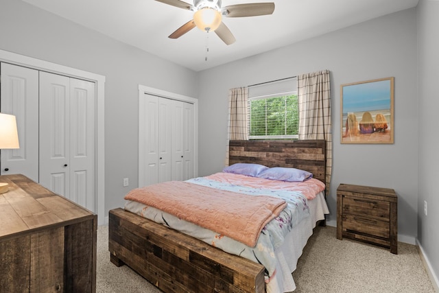 319 Key Lime Pl, Crestview, FL 32536 - carpeted bedroom featuring two closets, ceiling fan, and baseboards