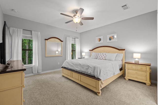 319 Key Lime Pl, Crestview, FL 32536 - bedroom featuring light carpet, multiple windows, and baseboards