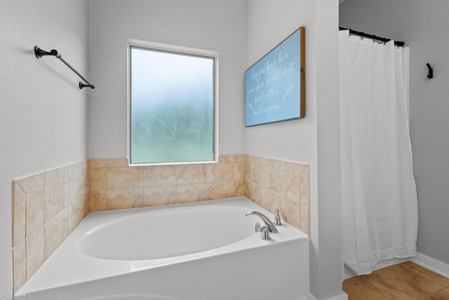 319 Key Lime Pl, Crestview, FL 32536 - bathroom featuring a bath, baseboards, and a shower with shower curtain