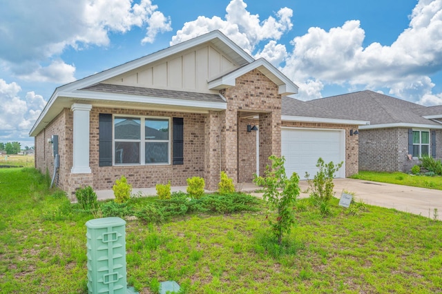 4652 Honor Guard Way, Crestview, FL 32539 - ranch-style home featuring board and batten siding, an attached garage, brick siding, concrete driveway, and a front lawn