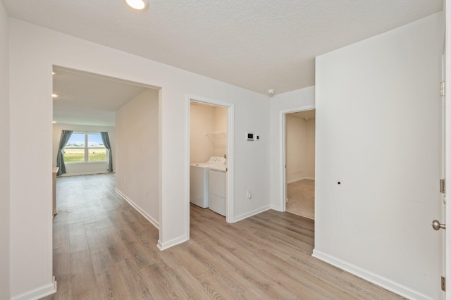 4652 Honor Guard Way, Crestview, FL 32539 - spare room with washing machine and clothes dryer and light wood-type flooring