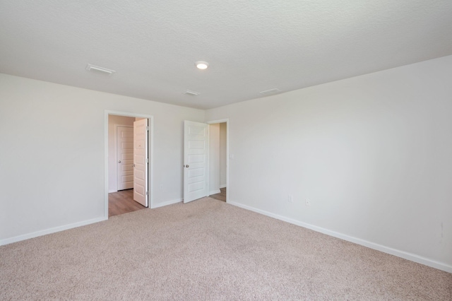 4652 Honor Guard Way, Crestview, FL 32539 - unfurnished bedroom featuring light colored carpet and recessed lighting