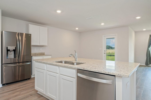 4652 Honor Guard Way, Crestview, FL 32539 - kitchen with stainless steel appliances, light wood-style floors, white cabinetry, and recessed lighting