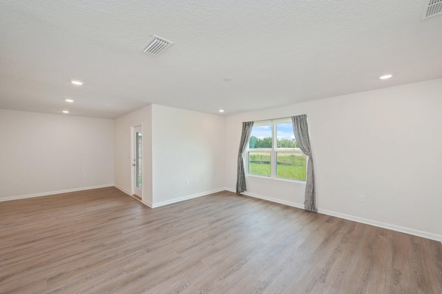 4652 Honor Guard Way, Crestview, FL 32539 - unfurnished room featuring wood finished floors and recessed lighting