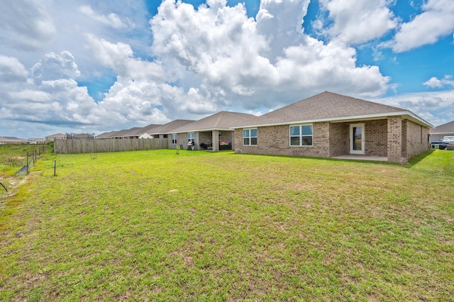 4652 Honor Guard Way, Crestview, FL 32539 - rear view of property with brick siding and a patio