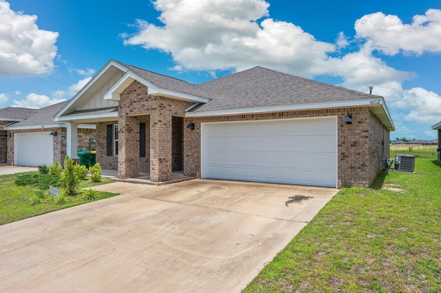 4652 Honor Guard Way, Crestview, FL 32539 - ranch-style home with brick siding, driveway, a garage, a front lawn, and board and batten siding