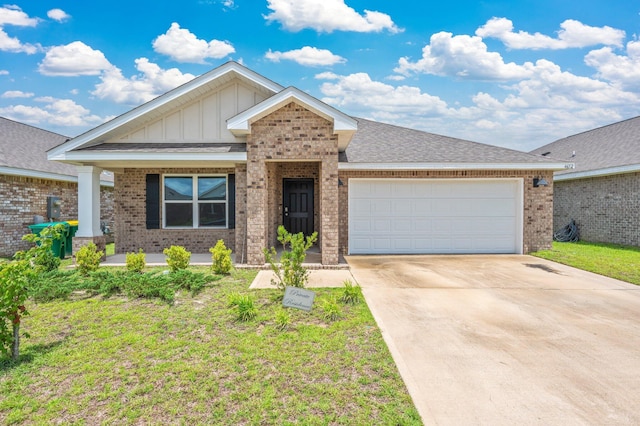 4652 Honor Guard Way, Crestview, FL 32539 - single story home featuring brick siding, board and batten siding, an attached garage, and driveway