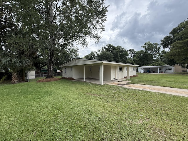 110 Tyner Dr, Crestview, FL 32539 - view of front of home featuring an attached carport and concrete driveway