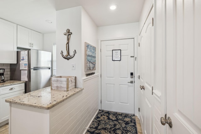 23011 Front Beach Rd Unit E-20, Panama City Beach, FL 32413 - doorway with light tile patterned flooring and recessed lighting