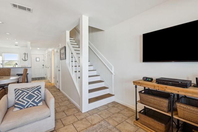 23011 Front Beach Rd Unit E-20, Panama City Beach, FL 32413 - living room with stairs, baseboards, and recessed lighting