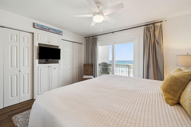 23011 Front Beach Rd Unit E-20, Panama City Beach, FL 32413 - bedroom with two closets, access to exterior, dark wood finished floors, and ceiling fan