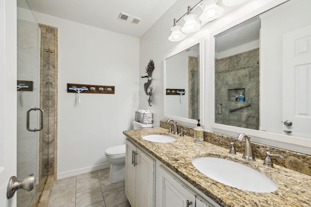23011 Front Beach Rd Unit E-20, Panama City Beach, FL 32413 - full bath featuring toilet, a stall shower, double vanity, baseboards, and tile patterned flooring