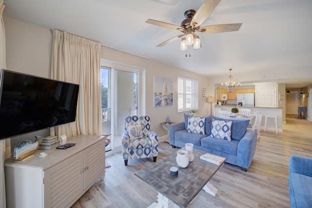 112 Seascape Blvd Unit 210, Miramar Beach, FL 32550 - living area with a chandelier, light wood-style floors, and a ceiling fan