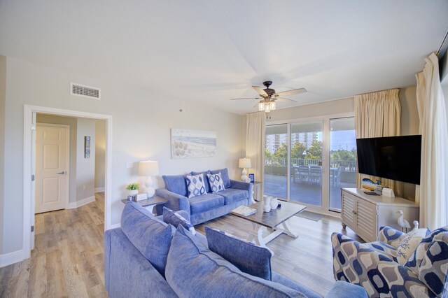 112 Seascape Blvd Unit 210, Miramar Beach, FL 32550 - living room with a ceiling fan and light wood-type flooring