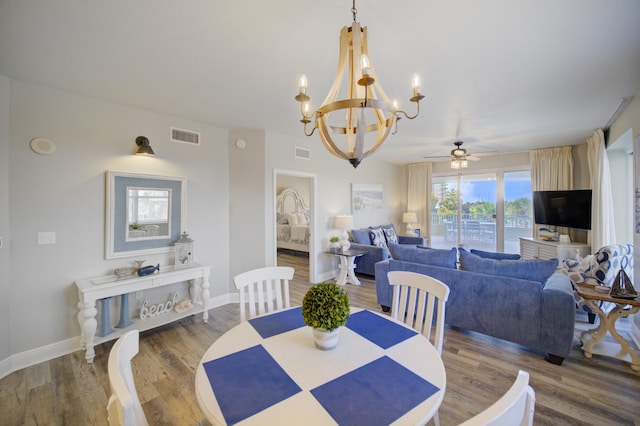 112 Seascape Blvd Unit 210, Miramar Beach, FL 32550 - dining space with a chandelier, ceiling fan, and wood finished floors