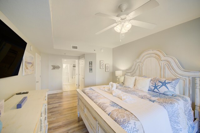 112 Seascape Blvd Unit 210, Miramar Beach, FL 32550 - bedroom with light wood-type flooring, connected bathroom, and ceiling fan