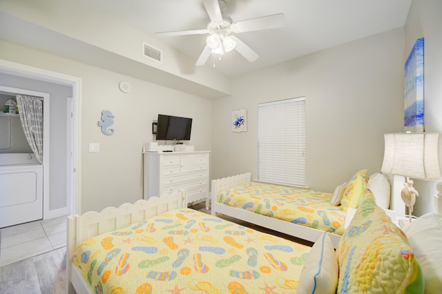 112 Seascape Blvd Unit 210, Miramar Beach, FL 32550 - bedroom featuring washer / clothes dryer, wood finished floors, and a ceiling fan