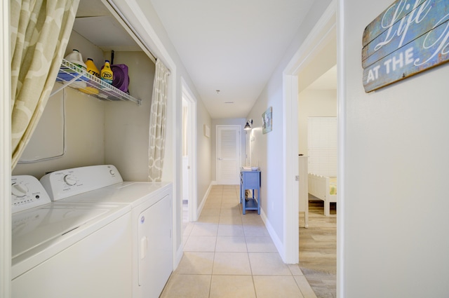 112 Seascape Blvd Unit 210, Miramar Beach, FL 32550 - laundry room with washing machine and dryer and light tile patterned floors