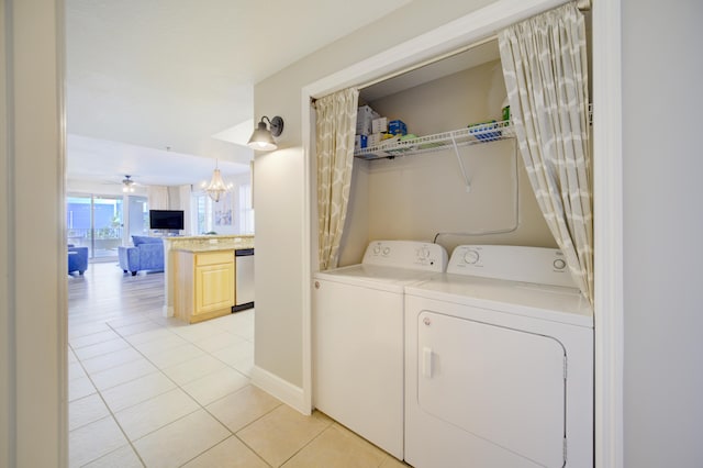 112 Seascape Blvd Unit 210, Miramar Beach, FL 32550 - laundry area with separate washer and dryer, light tile patterned floors, and a chandelier