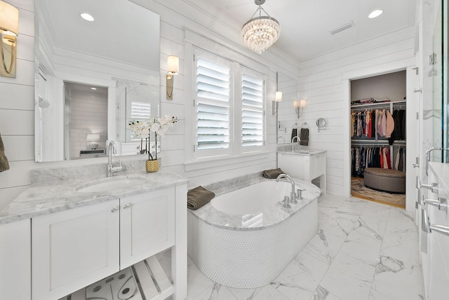 339 Pathways Dr, Inlet Beach, FL 32461 - bathroom featuring marble finish flooring, vanity, a bath, a spacious closet, and a chandelier