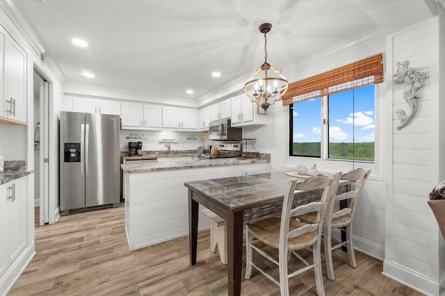 23223 Front Beach Rd # 335, Panama City Beach, FL 32413 - dining space with light wood-style flooring, a chandelier, ornamental molding, and recessed lighting