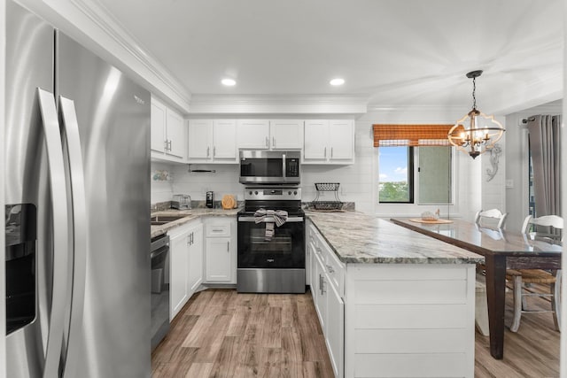 23223 Front Beach Rd # 335, Panama City Beach, FL 32413 - kitchen featuring stainless steel appliances, light wood-style flooring, a chandelier, white cabinets, and crown molding