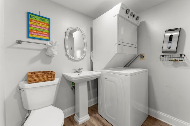23223 Front Beach Rd # 335, Panama City Beach, FL 32413 - half bathroom featuring toilet, wood finished floors, and baseboards