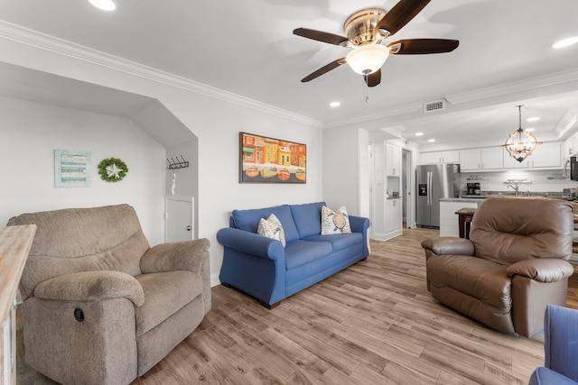 23223 Front Beach Rd # 335, Panama City Beach, FL 32413 - living area with ceiling fan, recessed lighting, light wood finished floors, ornamental molding, and baseboards