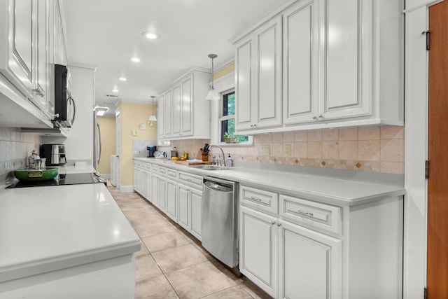 619 Pitts Bayshore Dr, Freeport, FL 32439 - kitchen featuring stainless steel dishwasher, backsplash, white cabinets, light countertops, and recessed lighting
